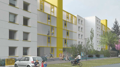 Perspektive der Eingangsseite, weiße Fassade mit Aufzugsturm in Gelb